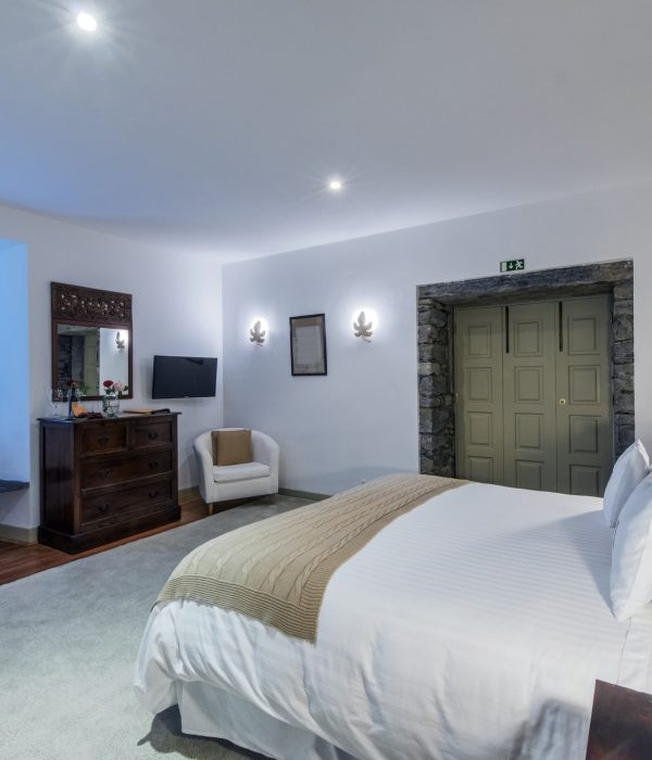 Bed and vanity in hotel room